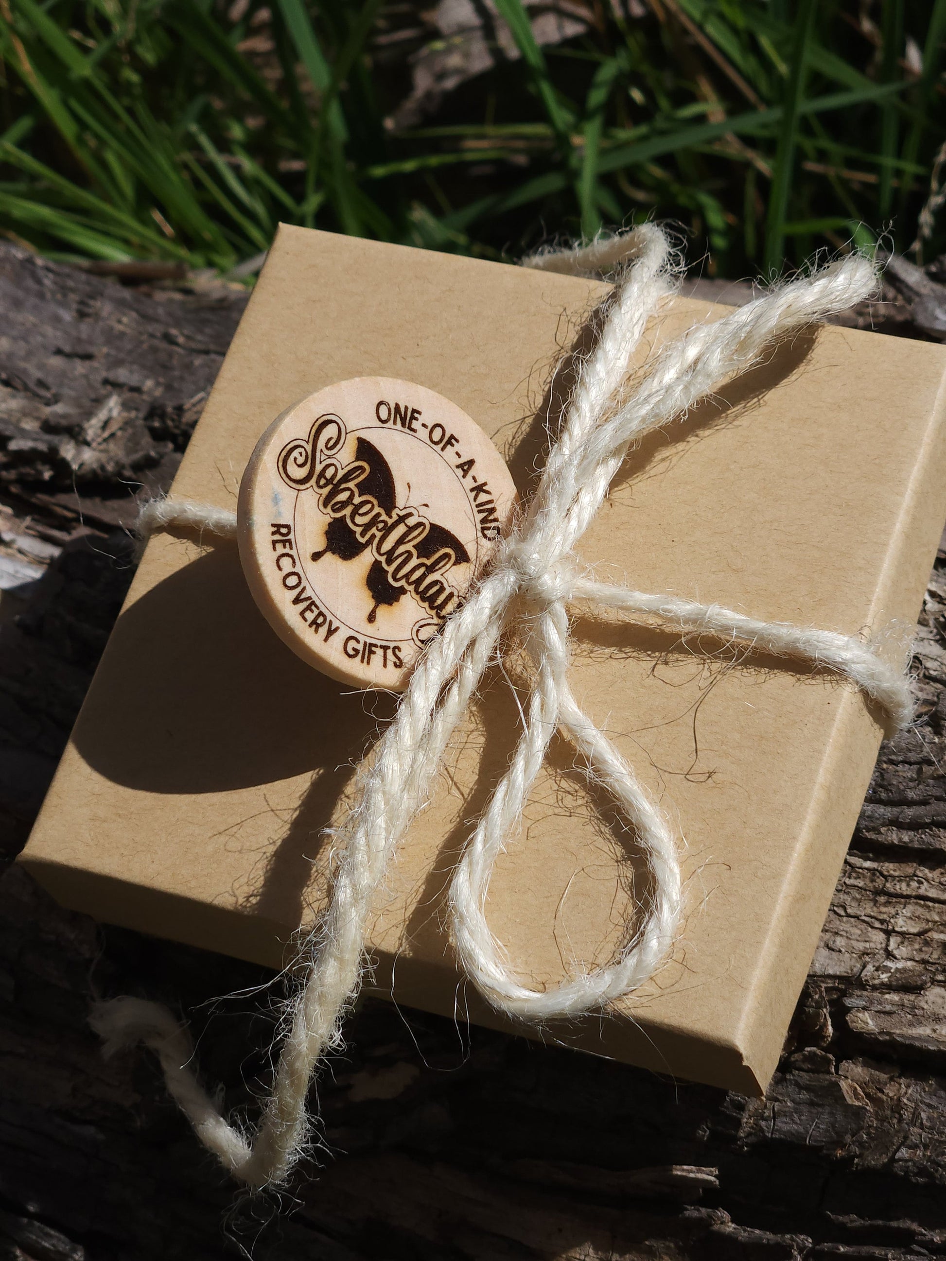 Hand holding Majestic Buck sobriety milestone gift