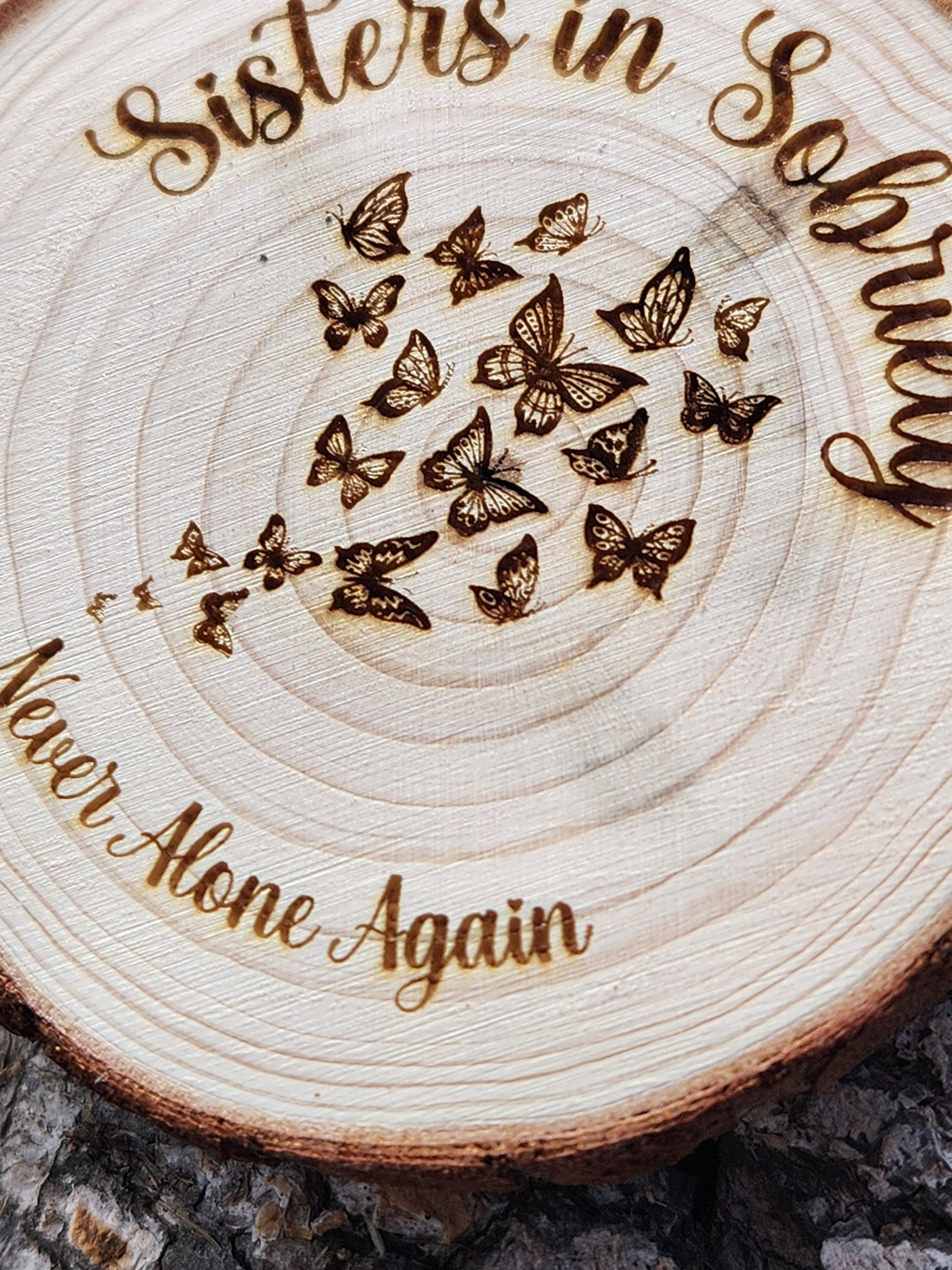 Newcomer Welcome Chip Caterpillar Butterflies wood medallion natural grain detail