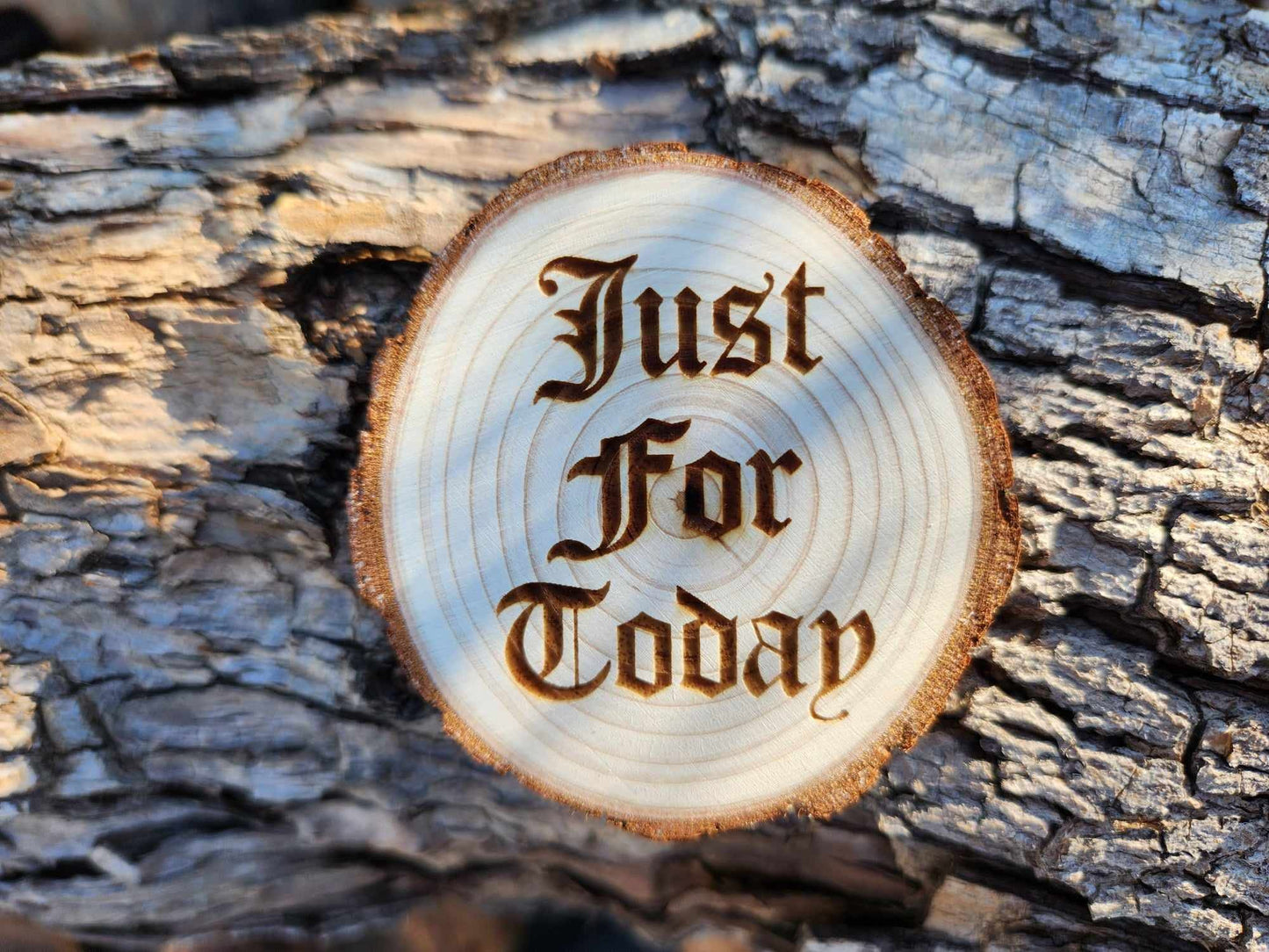 Soaring Eagle natural wood sobriety token closeup